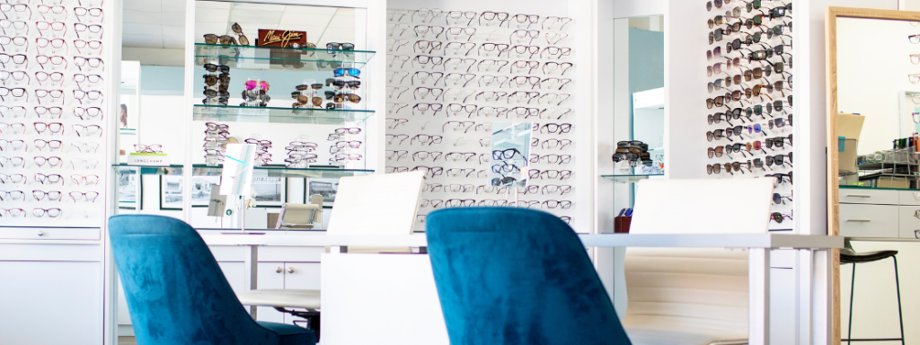 Inside of an optical office with several pairs of glasses and sunglasses on display