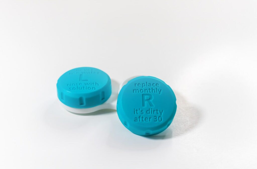 A contact lens case with a blue hue and a lid that needs replacement every month.