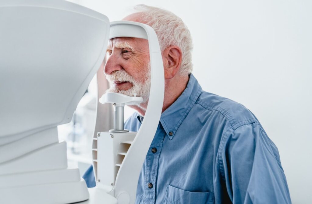 An older adult man getting a regular eye exam to as preventative measures for managing cataracts & glaucoma.